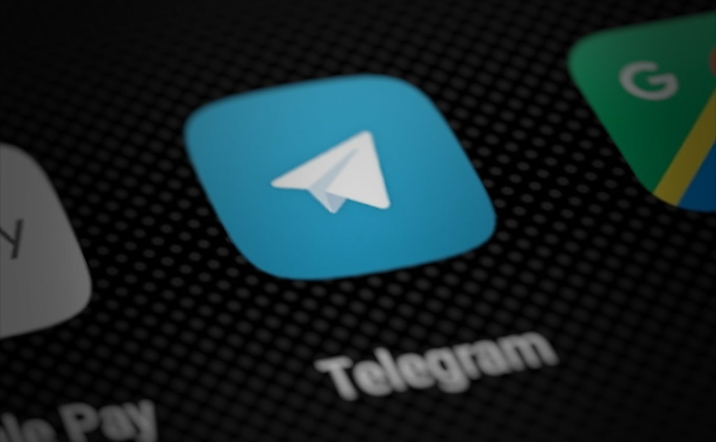 "Telegram app icon on smartphone screen (perspective render)" by Yu. Samoilov is marked with CC BY 2.0.